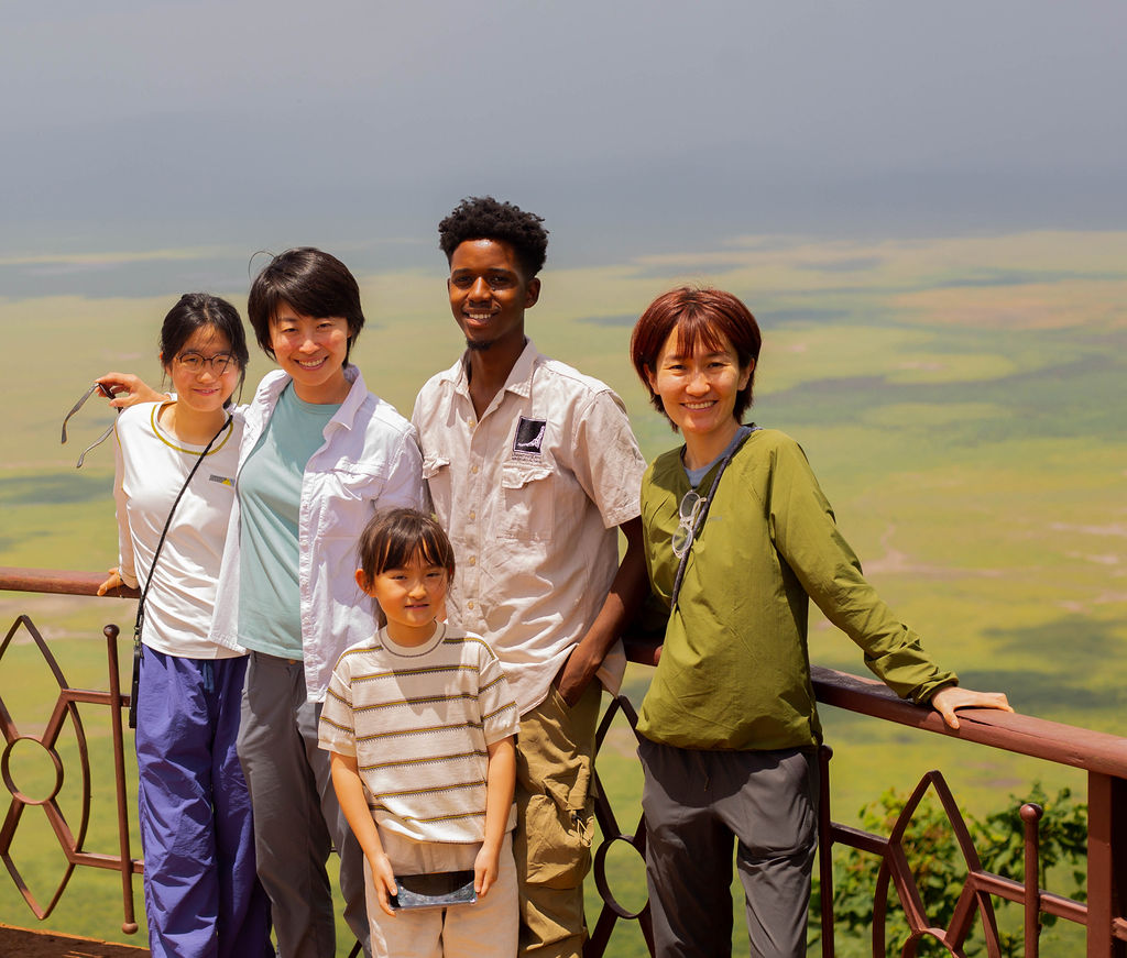 Family at the Ngorongoro Crater rim viewpoint with the crater floor below